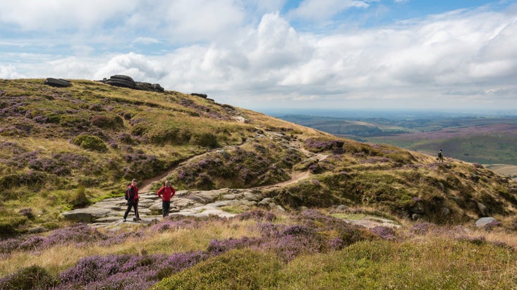 Rangers inspecting the landscape at Kinder Scout, Derbyshire